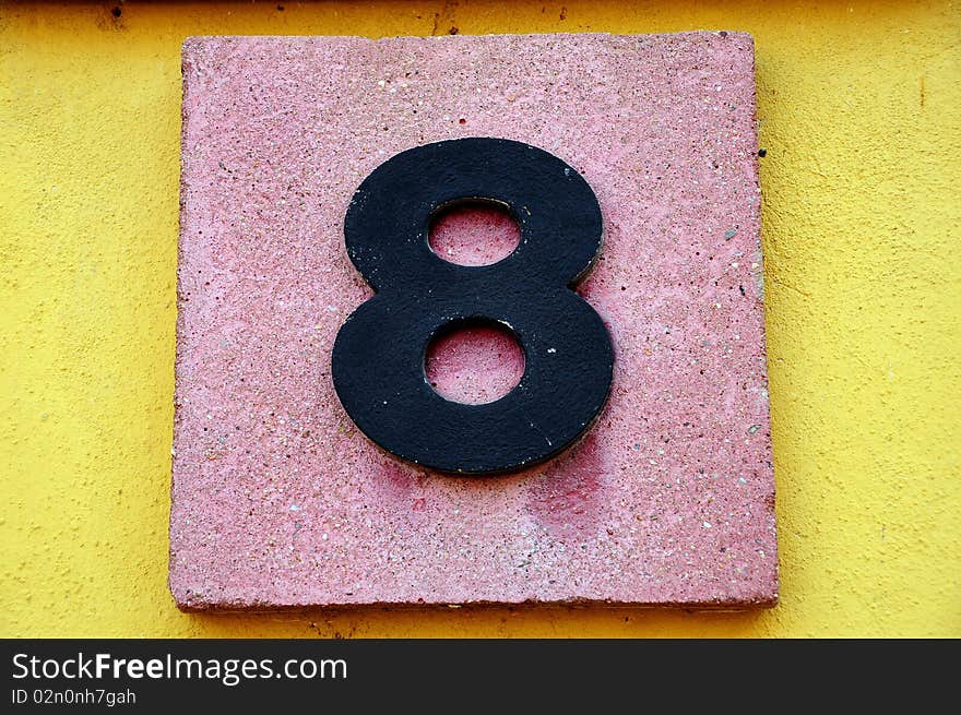 Number eight on a stone board