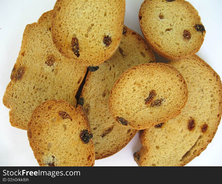 The photo shows sweet crackers with raisins. The photo shows sweet crackers with raisins