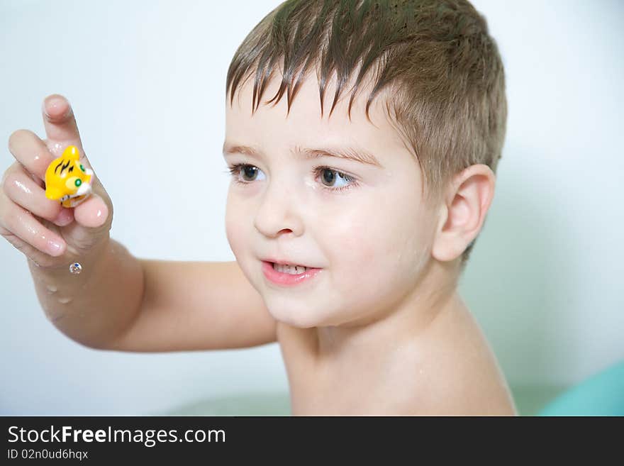 A little boy in the bathroom, the bath. A little boy in the bathroom, the bath