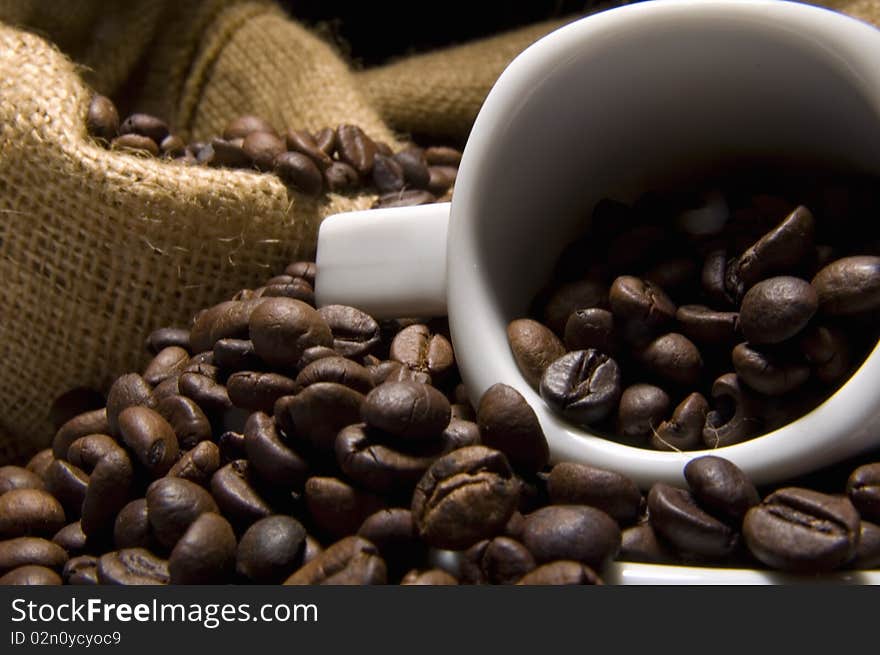 Espresso cup with roasted coffee beans