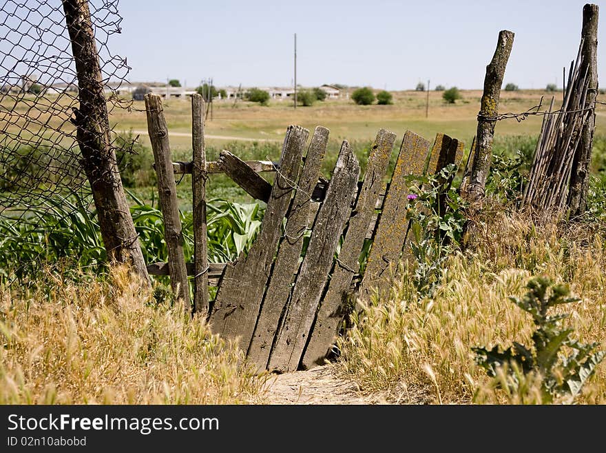 The old wooden door to an abandoned farm field. The old wooden door to an abandoned farm field