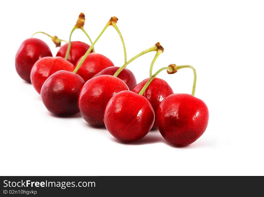 Ripe berries of a sweet cherry  on a white background. Ripe berries of a sweet cherry  on a white background