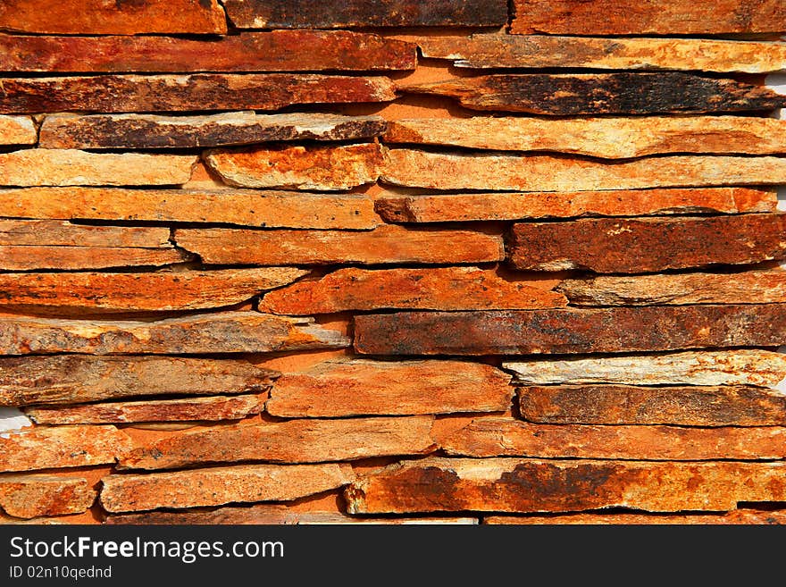 The stone wall of untreated wild-slate