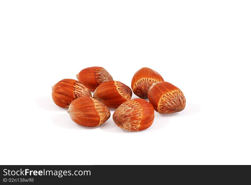 Hazelnuts hazelnuts on a secluded white. Hazelnuts hazelnuts on a secluded white