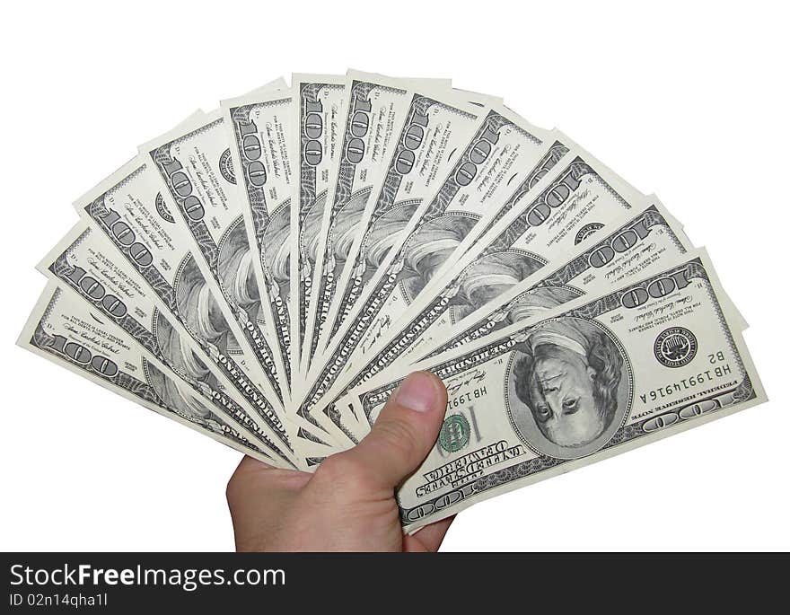 Dollar denominations in a hand on a white background. Dollar denominations in a hand on a white background