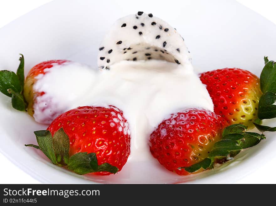 Strawberries and cream Pitahaya on a white plate