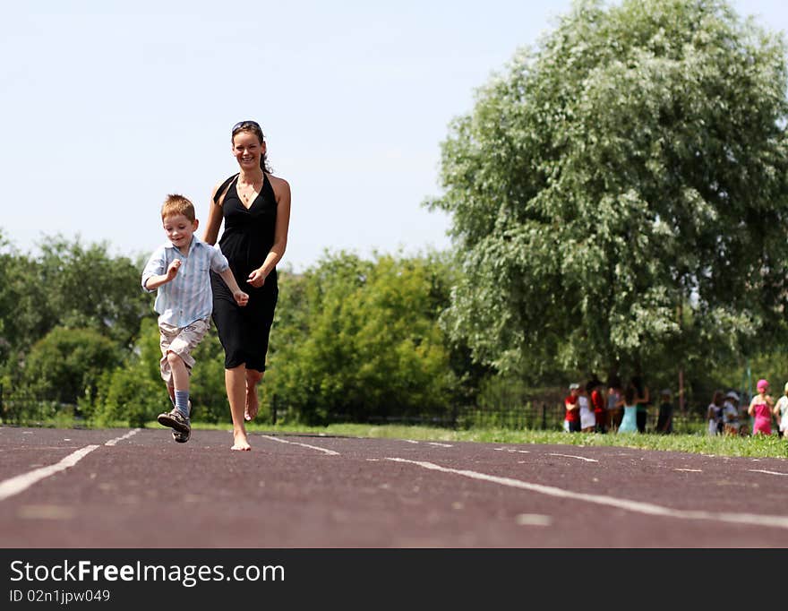 Happy mother and her little son outdoors session. Happy mother and her little son outdoors session