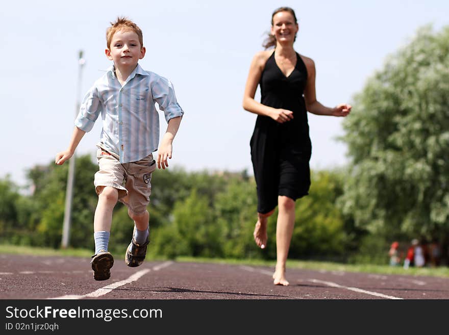 Happy mother and her little son outdoors session. Happy mother and her little son outdoors session