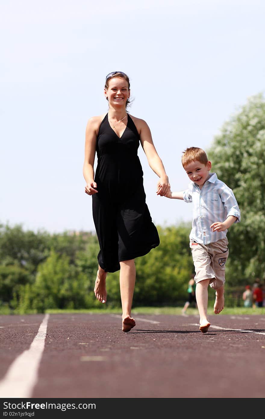 Happy mother and her little son outdoors session. Happy mother and her little son outdoors session