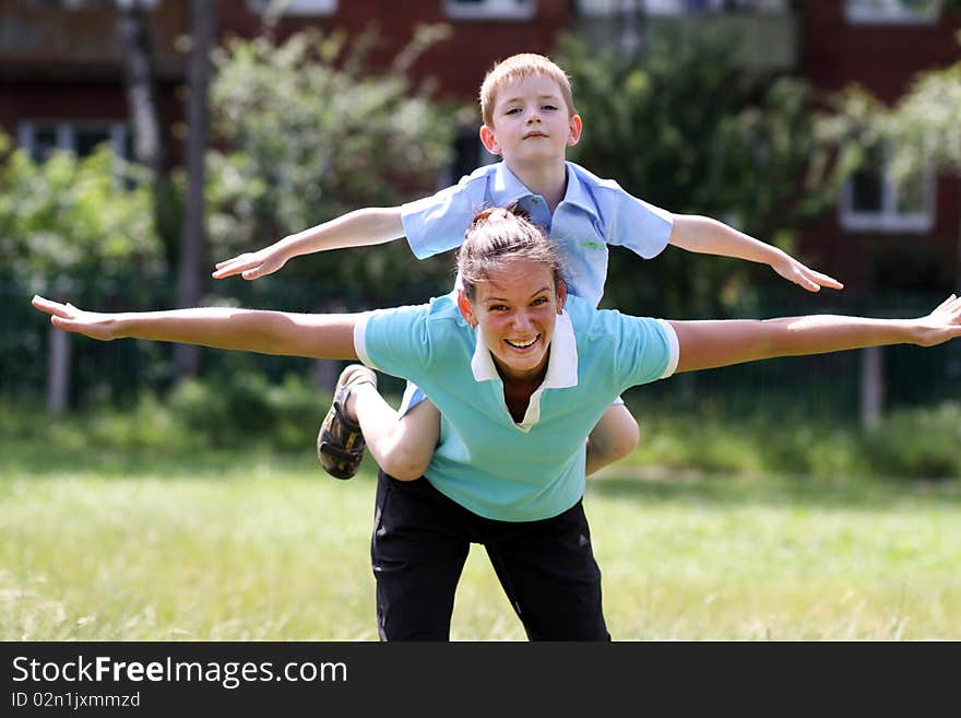 Happy mother and her little son outdoors session