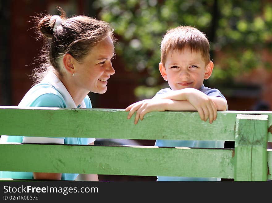 Happy mother and her little son outdoors session