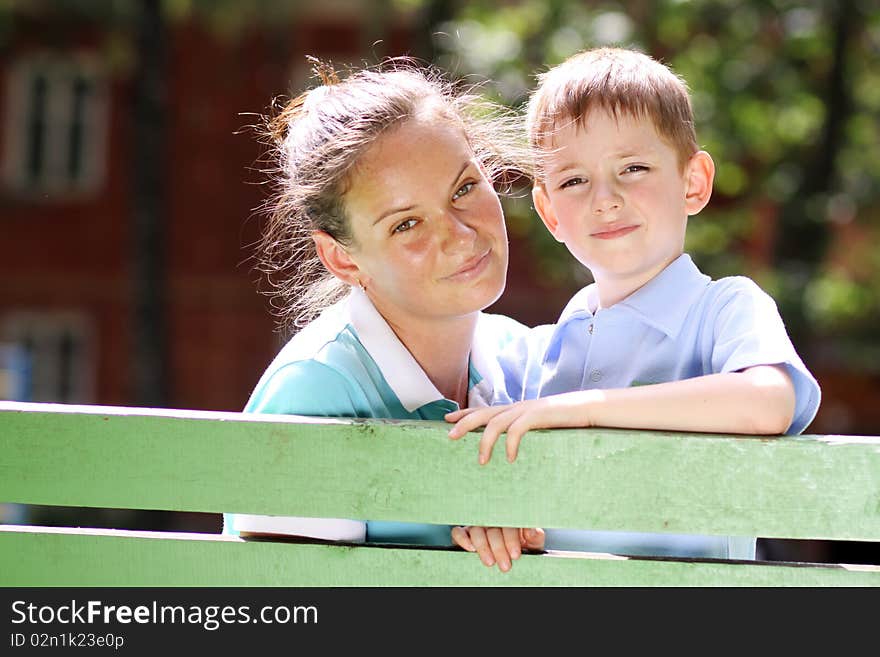 Happy mother and her little son outdoors session