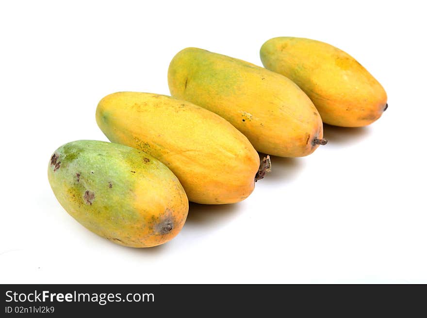 Ripe mangoes isolated over white background.