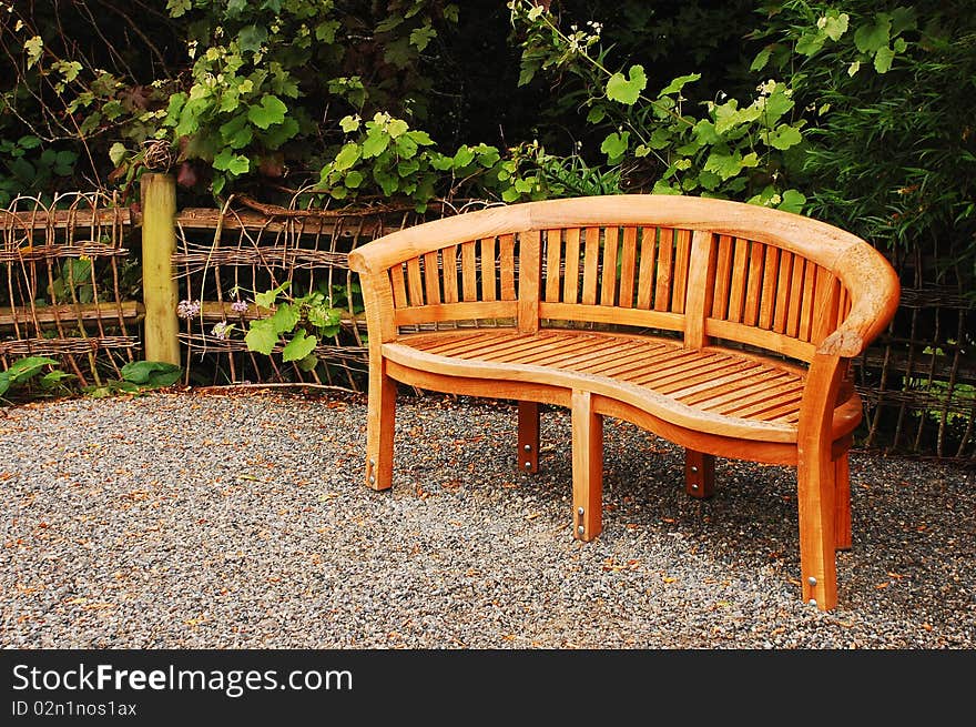 Wooden garden bench in pacific northwest garden