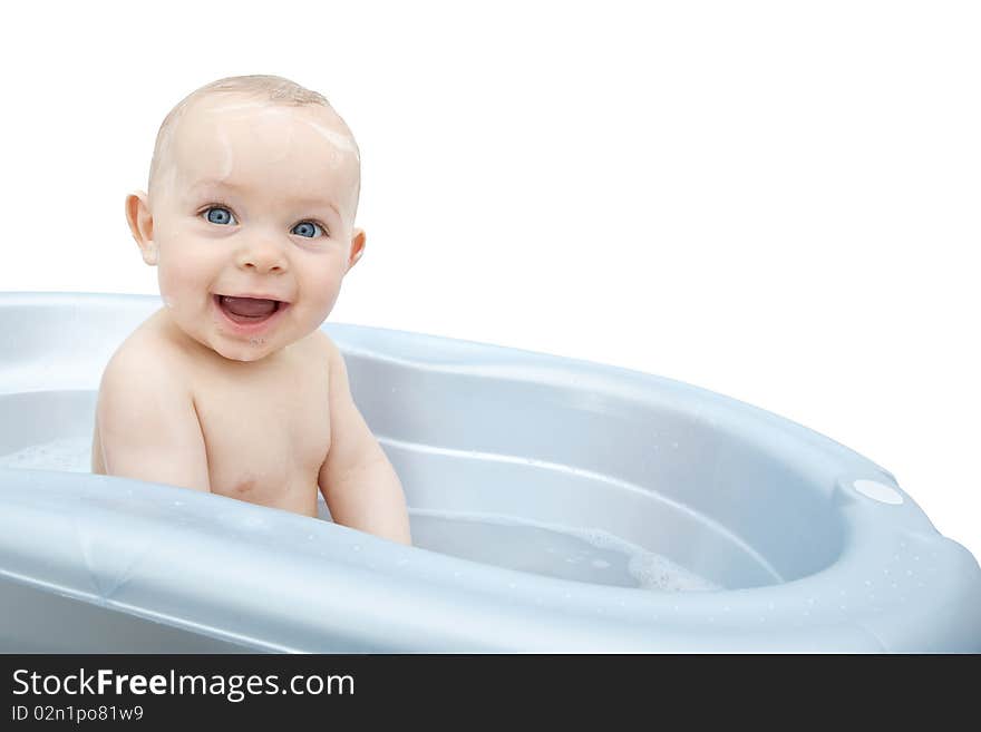 Smiling wet baby in a blue bathtub. Smiling wet baby in a blue bathtub.