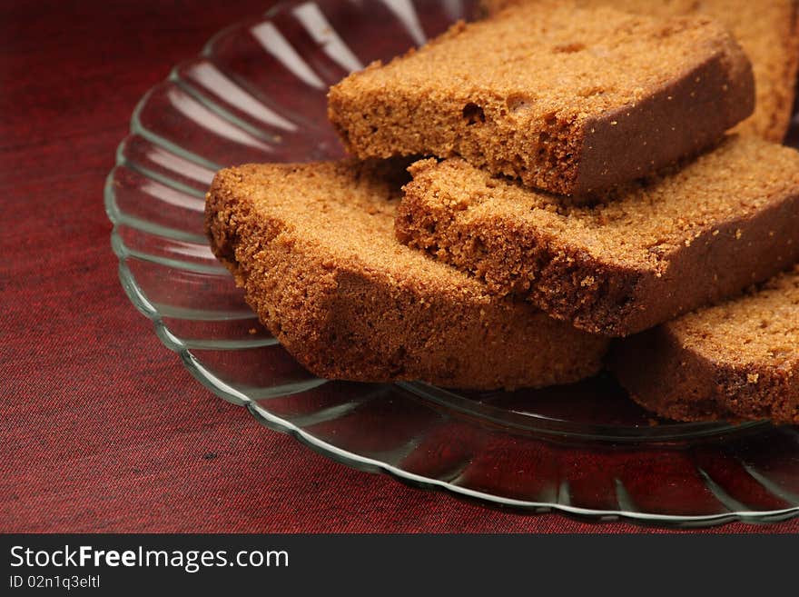 Slices of chocolate plum cake in a glass plate. Slices of chocolate plum cake in a glass plate