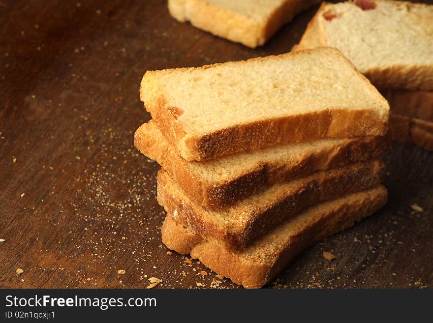 Baked raw rusks in a wooden table. Baked raw rusks in a wooden table.