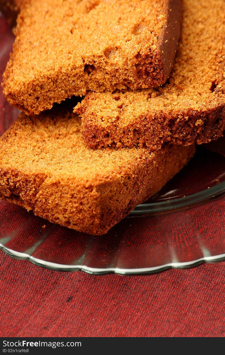 Slices of chocolate plum cake in a glass plate. Slices of chocolate plum cake in a glass plate