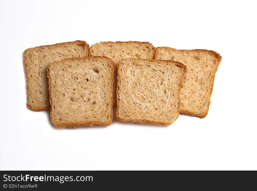 Slices of white bread on a white background