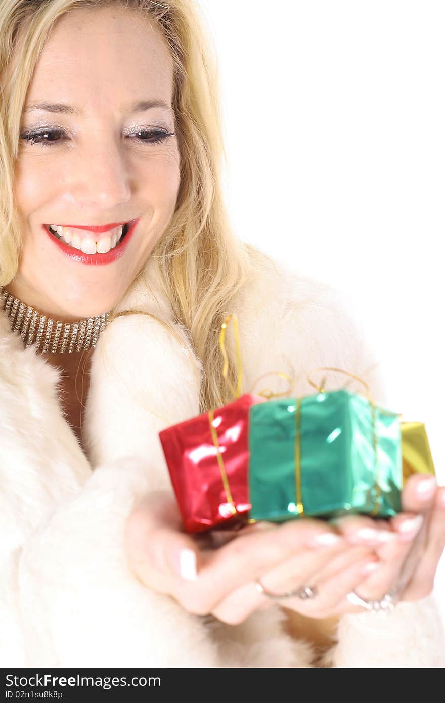 Happy blonde holding presents vertical