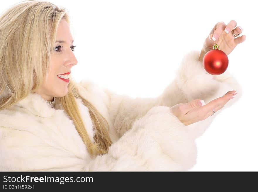 Gorgeous Blonde In Fur Holding An Ornament