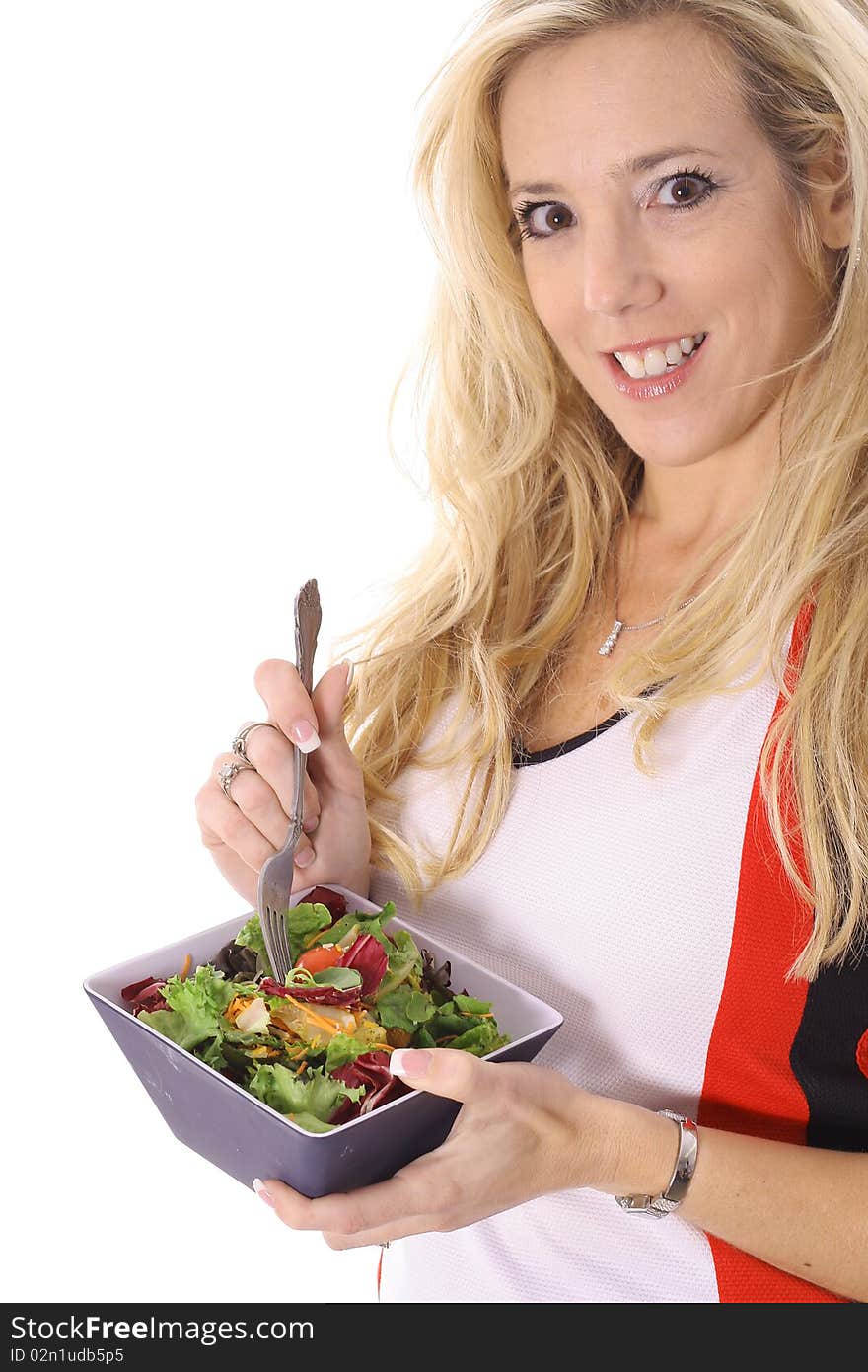 Beautiful blonde eating a salad