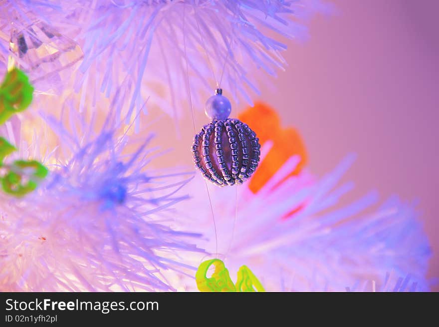 White Christmas tree in a blacklight. White Christmas tree in a blacklight