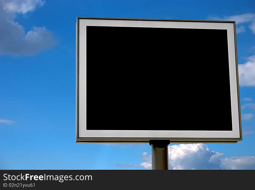 Blank black billboard over cloudy sky, prepared for your own design