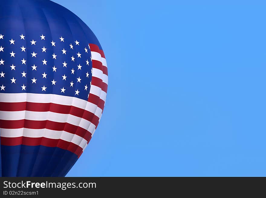 Hot air balloon in the sky with american flag design.