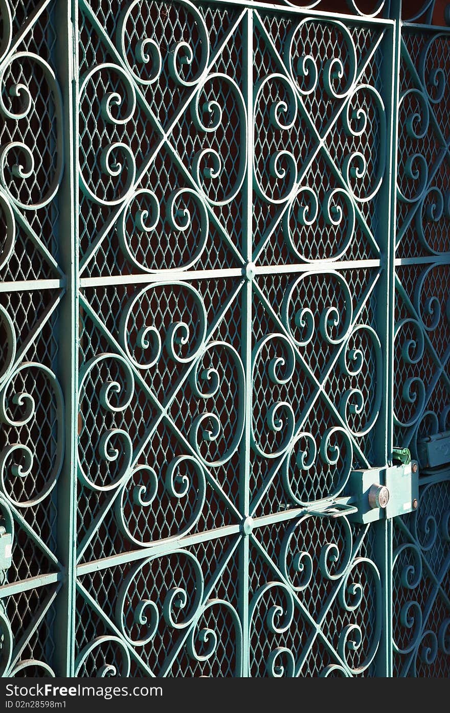 A Blue Scroll Iron Door Gate. A Blue Scroll Iron Door Gate