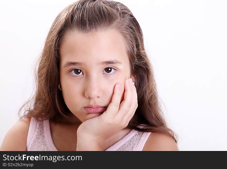 Bored girl looking at the camera over white background. Bored girl looking at the camera over white background