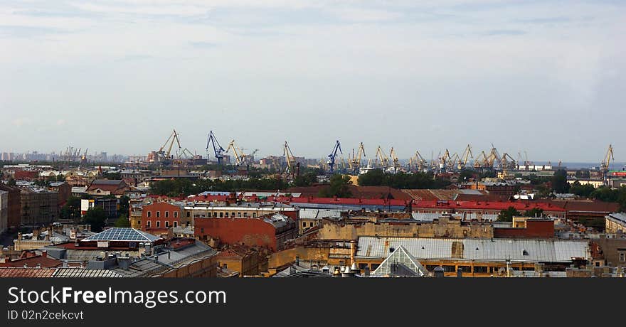 Aerial view of the city and the port cranes of Saint-Petersburg, Russia. Aerial view of the city and the port cranes of Saint-Petersburg, Russia.