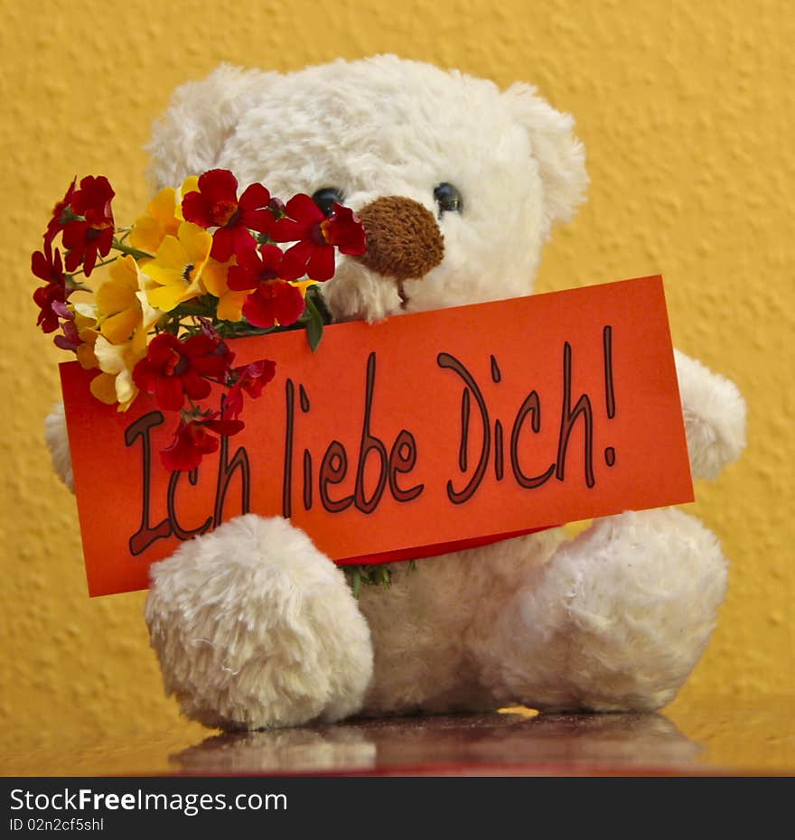 Teddy with card saying: Ich liebe dich! (German for I love you). Teddy with card saying: Ich liebe dich! (German for I love you)