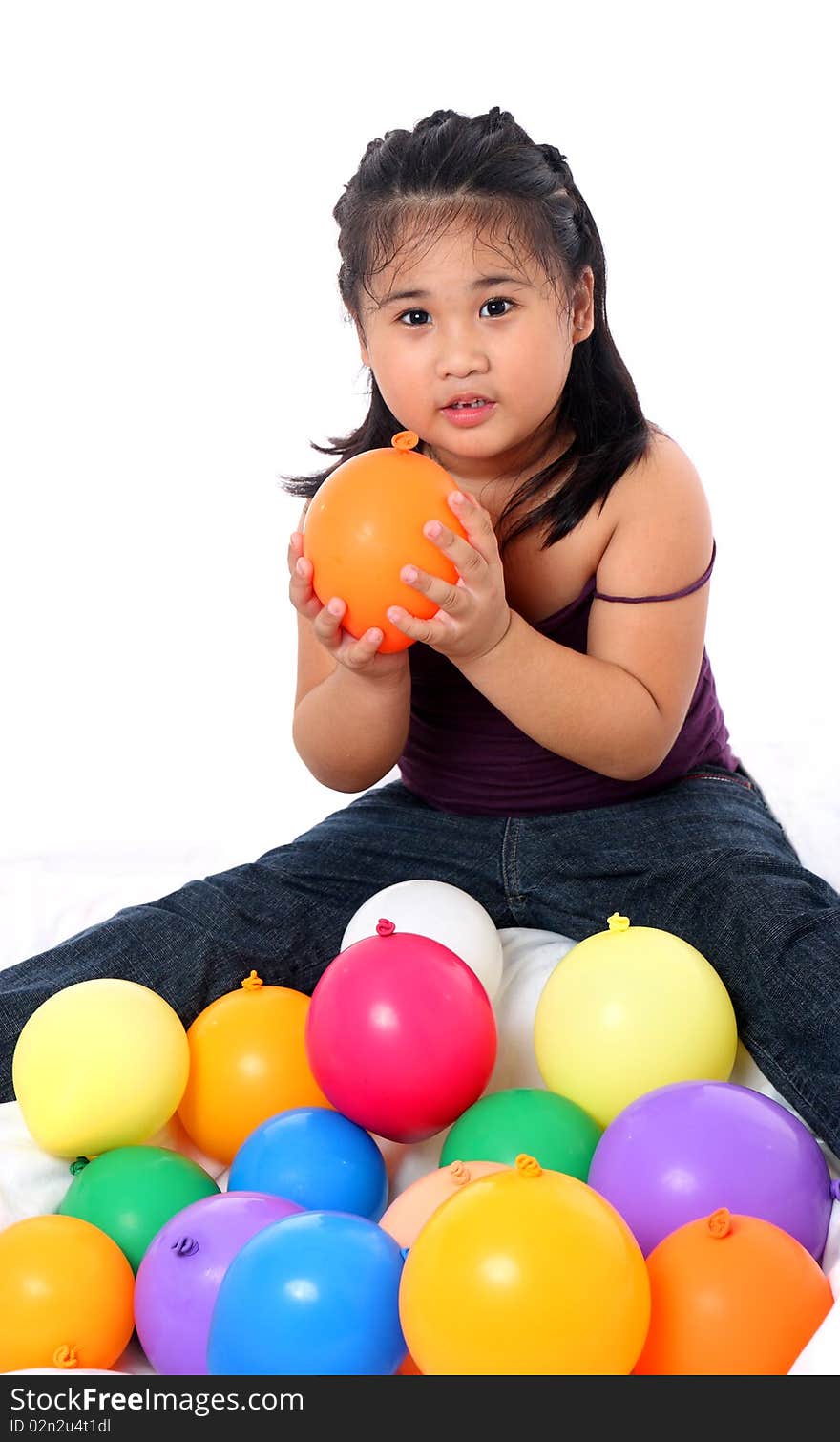 Young asian kid playing with balloons. Young asian kid playing with balloons