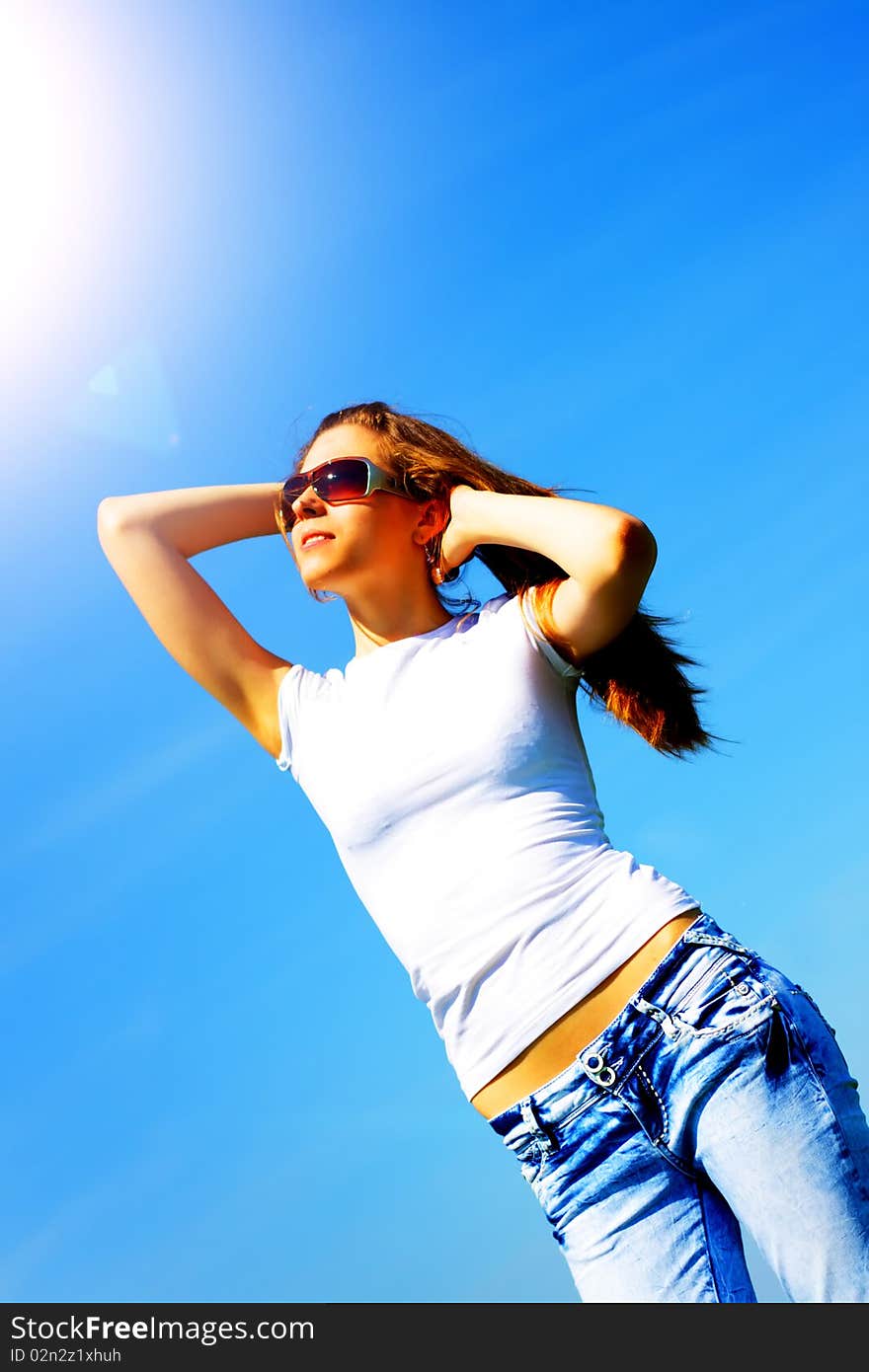 Girl against the blue sky