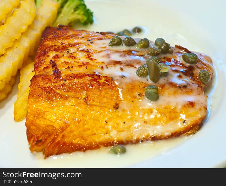 Salmon steak elegantly captured in a hotel fine dining. Salmon steak elegantly captured in a hotel fine dining