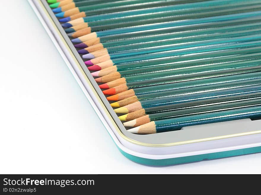 Close up of brand new colouring pencils in a tin box. Close up of brand new colouring pencils in a tin box