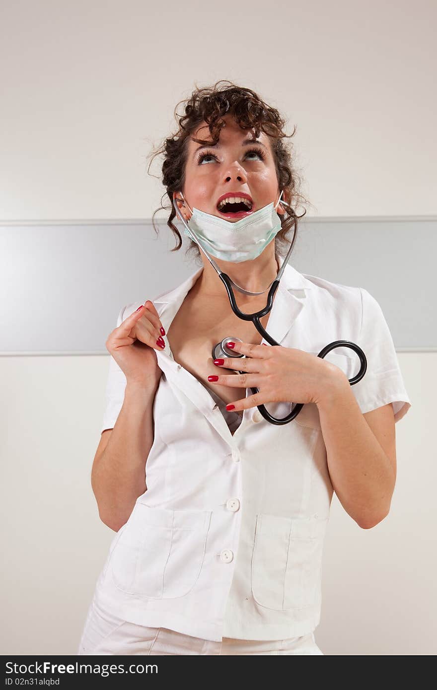 Young female doctor examining herself. Young female doctor examining herself