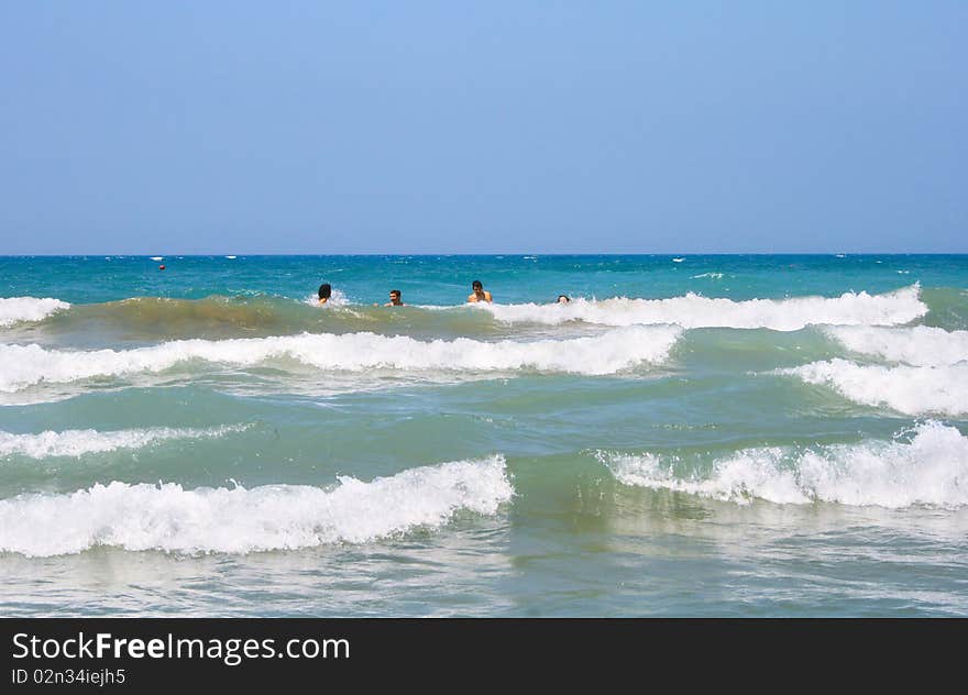 People On Sea Waves