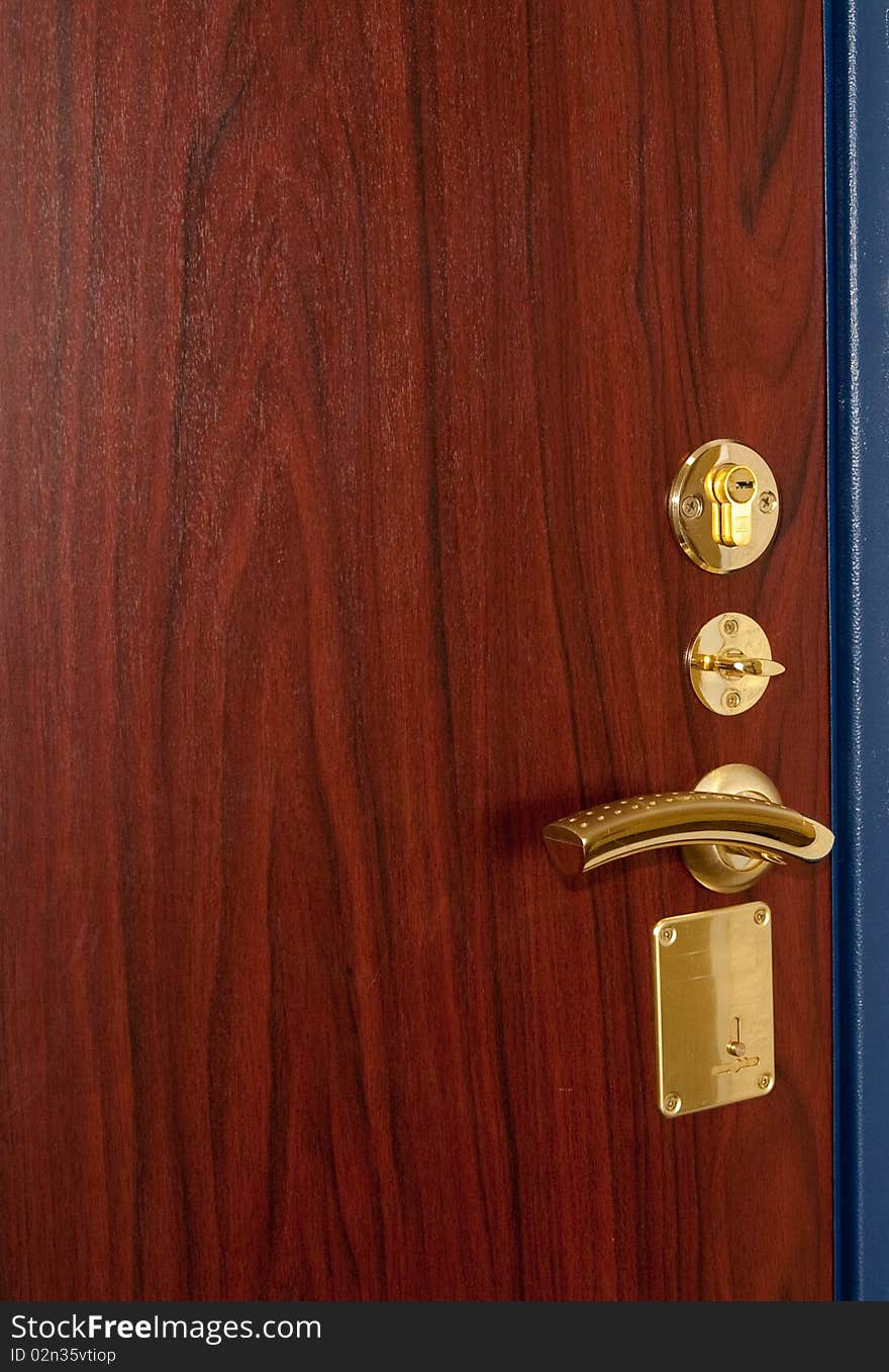 Modern golden doorlock with handle. Modern golden doorlock with handle