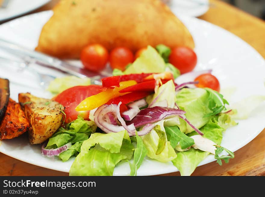 Fresh vegetable salad on white plate