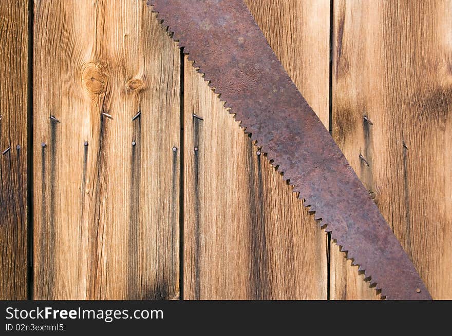 Rusty old saw on a wood background, Bodie Ghost Town. Rusty old saw on a wood background, Bodie Ghost Town.