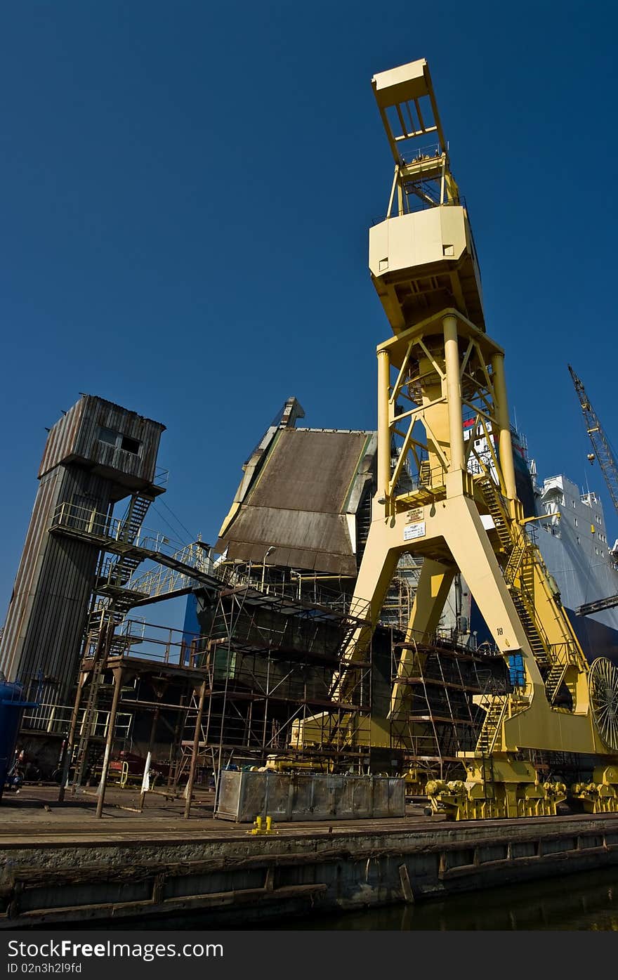 Crane helping to carry ship hardware. Crane helping to carry ship hardware