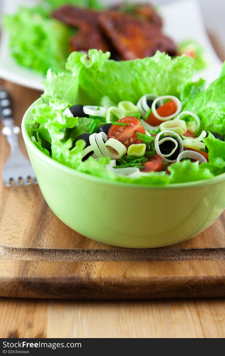 Vegetable saald in a white bowl. Vegetable saald in a white bowl