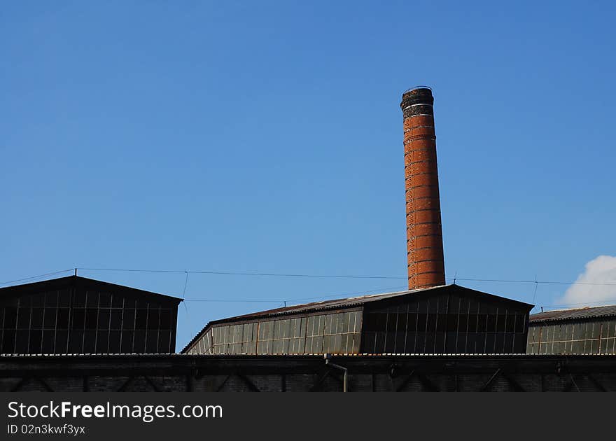 Building of antique factory with chimney. Building of antique factory with chimney