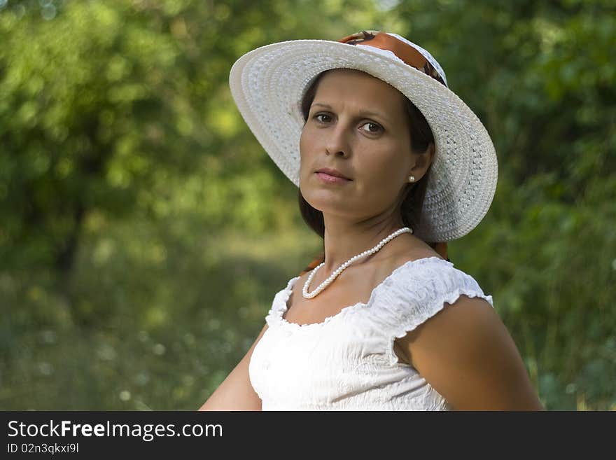 Portrait of lady in white hat