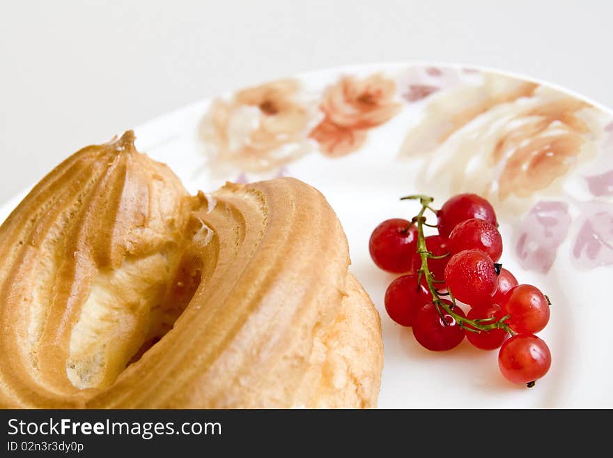 Cake with currant on a plate