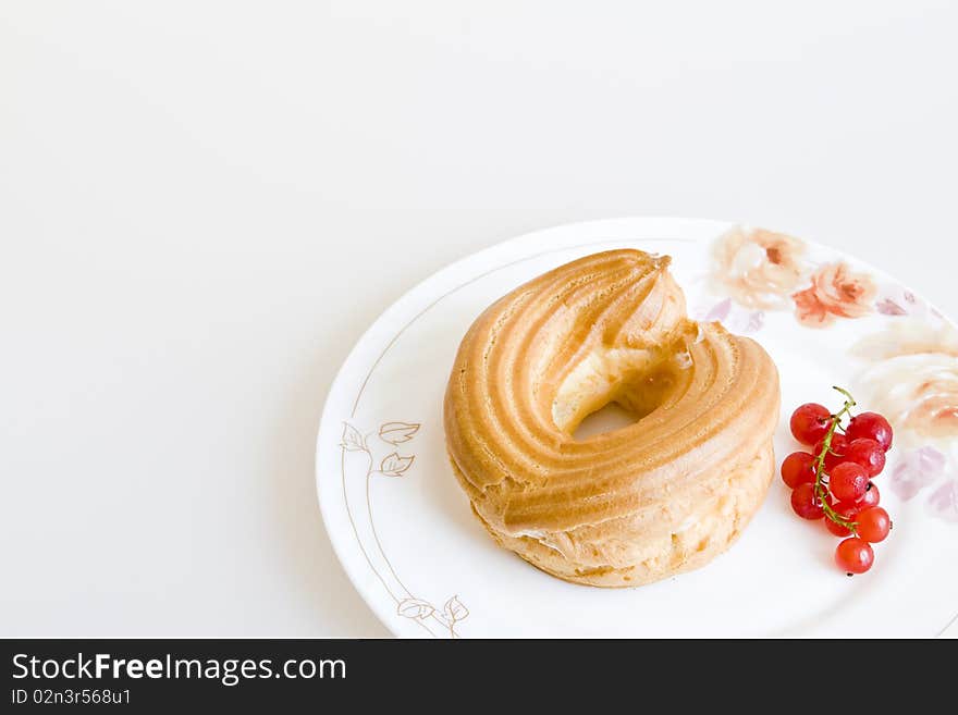 Cake with currant on a plate