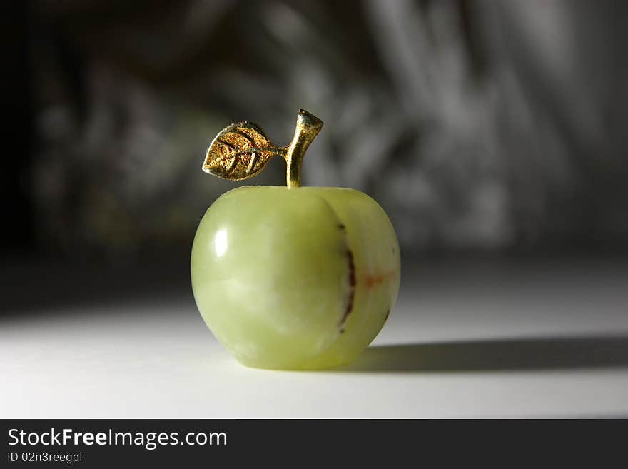 Green stone apple in hard light. Green stone apple in hard light