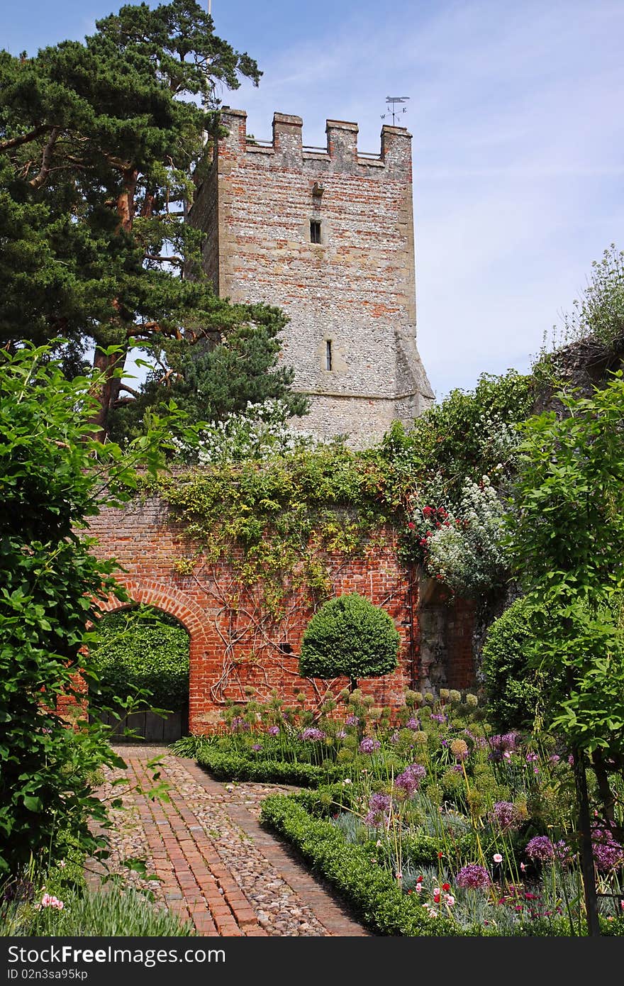 An English Walled garden with arched entrance through the Wall. An English Walled garden with arched entrance through the Wall